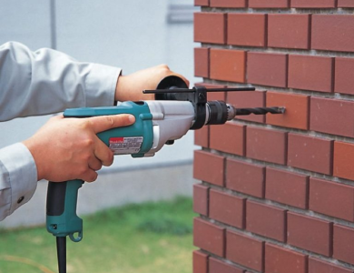 Máy khoan búa 2 tốc độ Makita HP2050